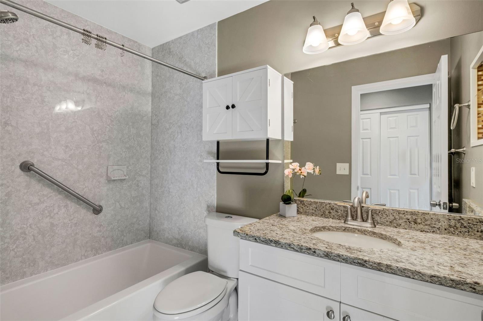 Guest Bath, Updated bath and bath tile, and vanity with granite.
