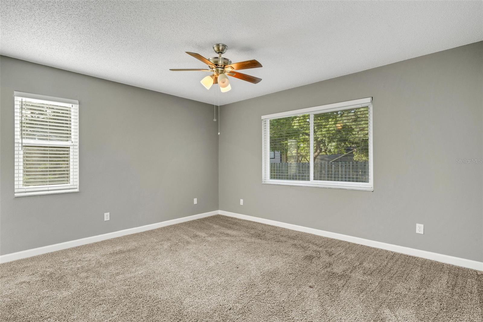 Primary bedroom with serene peaceful views.