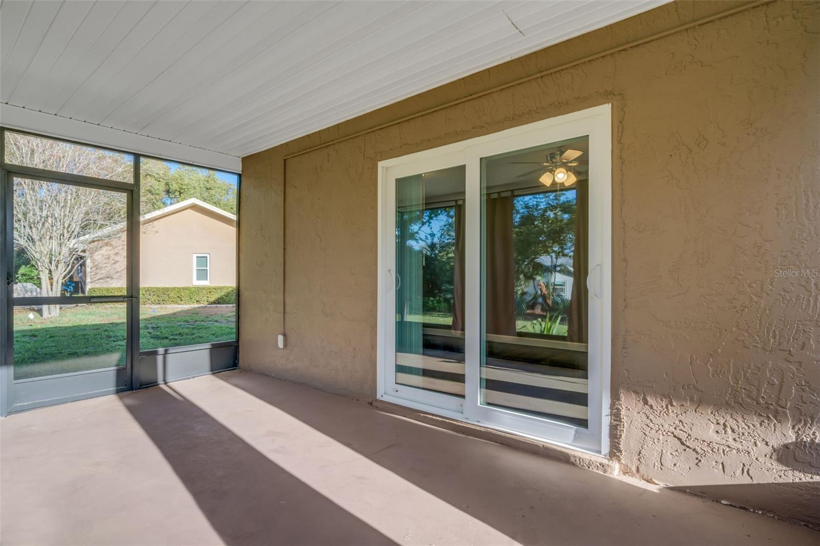 Impact slider to Family room and door to side yards