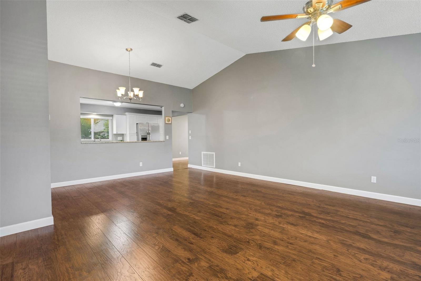 Large, open and spacious. Vaulted ceiling, kitchen wall removed and open to the kitchen.