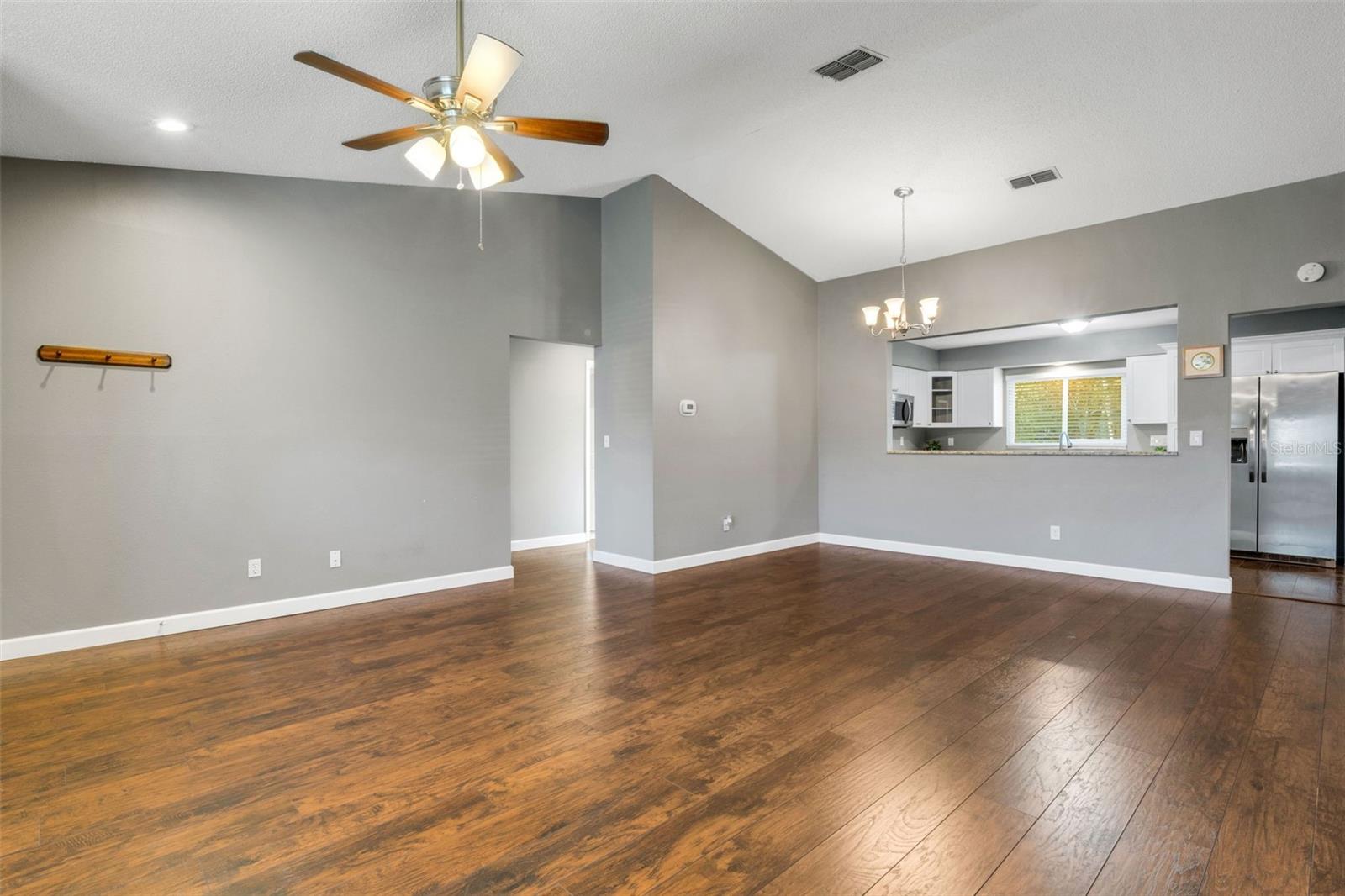 Hall way leads to bedrooms and guest bath.