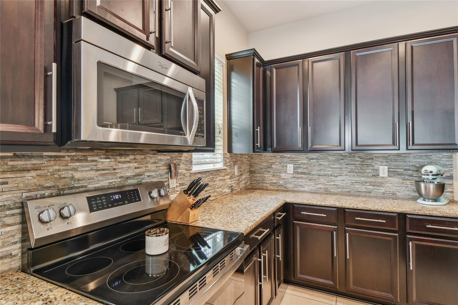 Stove and Cabinets in Kitchen