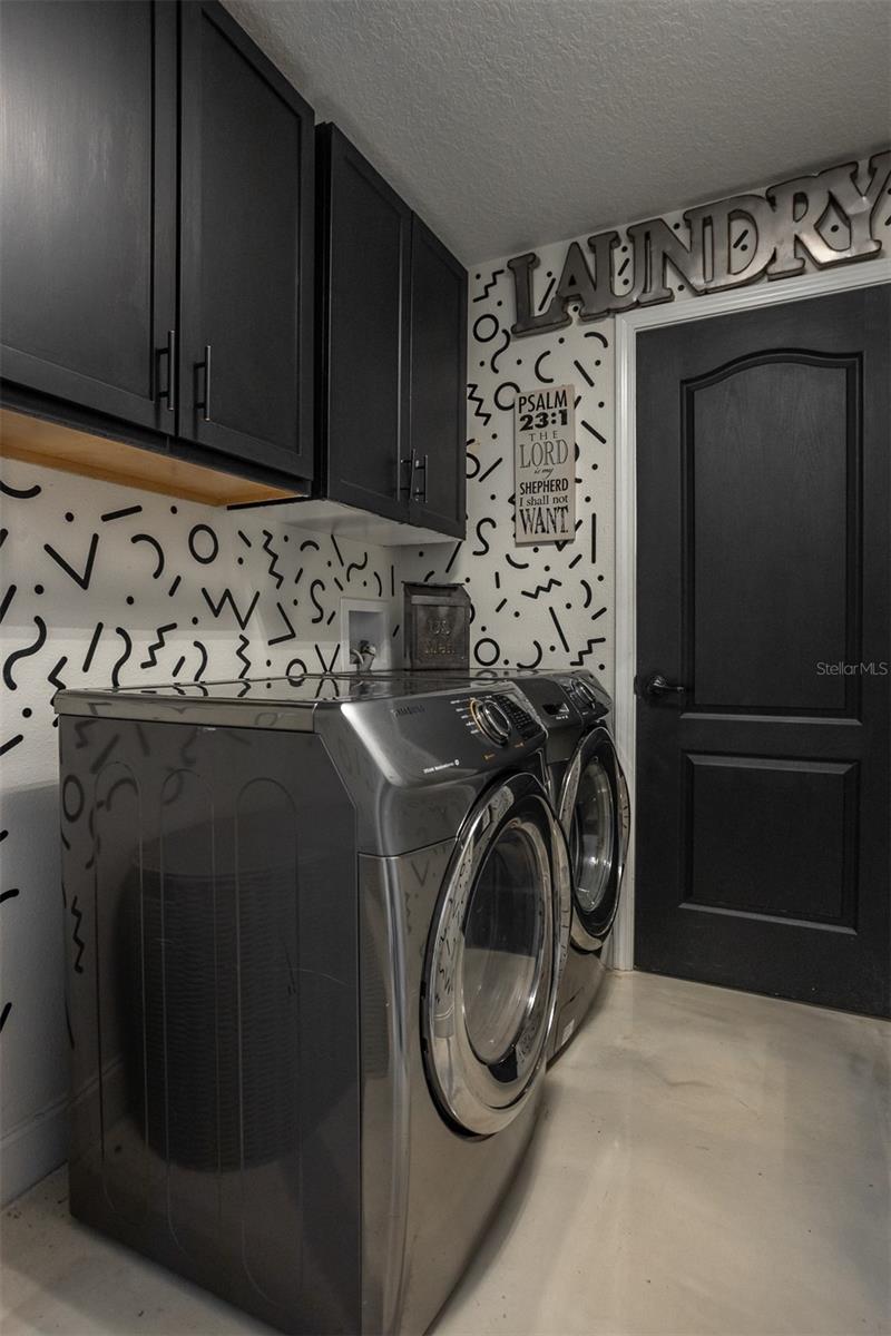 Close-up of high-efficiency Samsung steam washer and dryer set.