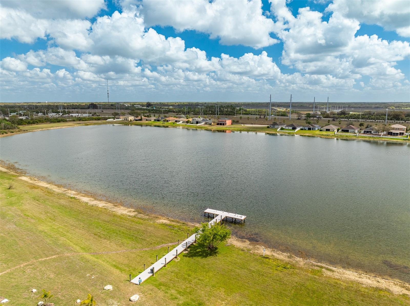 Wide view of the riverfront access area including the private community boardwalk.