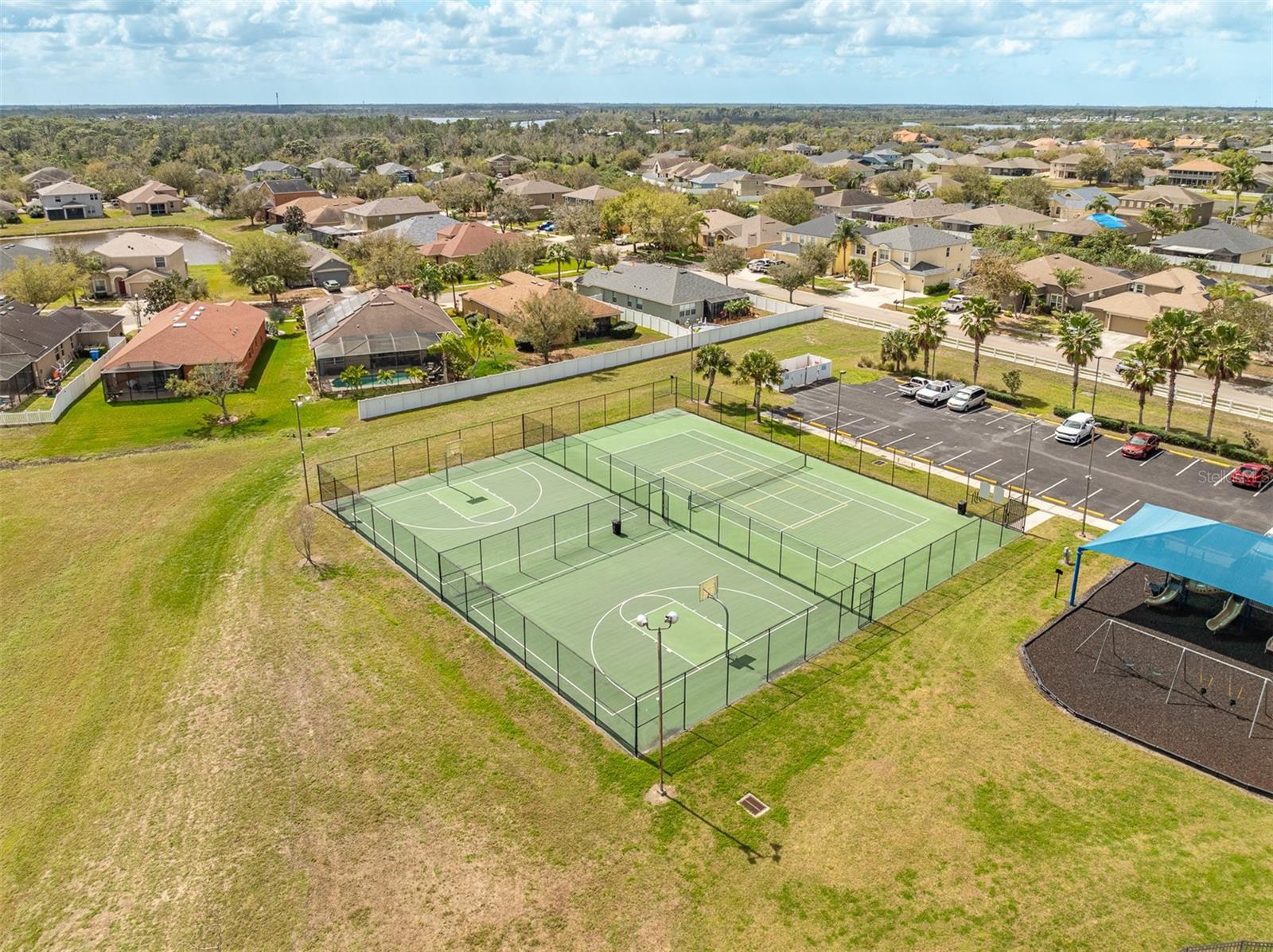 Full-size basketball and tennis courts available for River Bend residents.