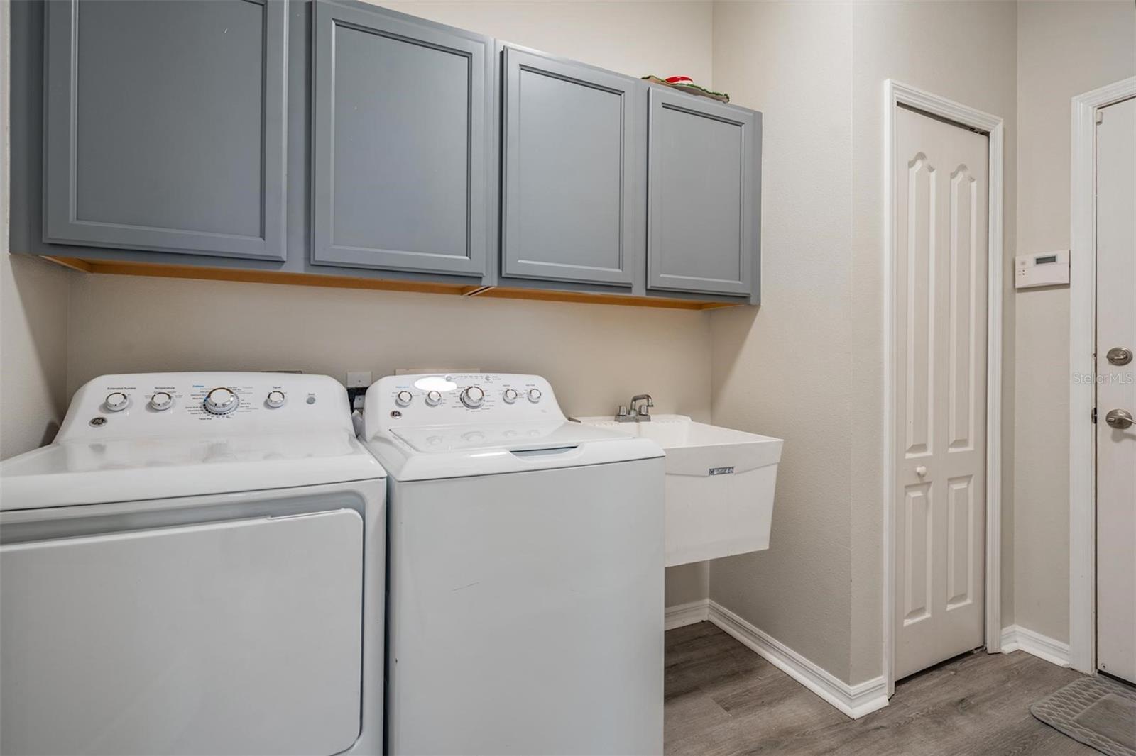 Walk-in laundry room with additional storage options