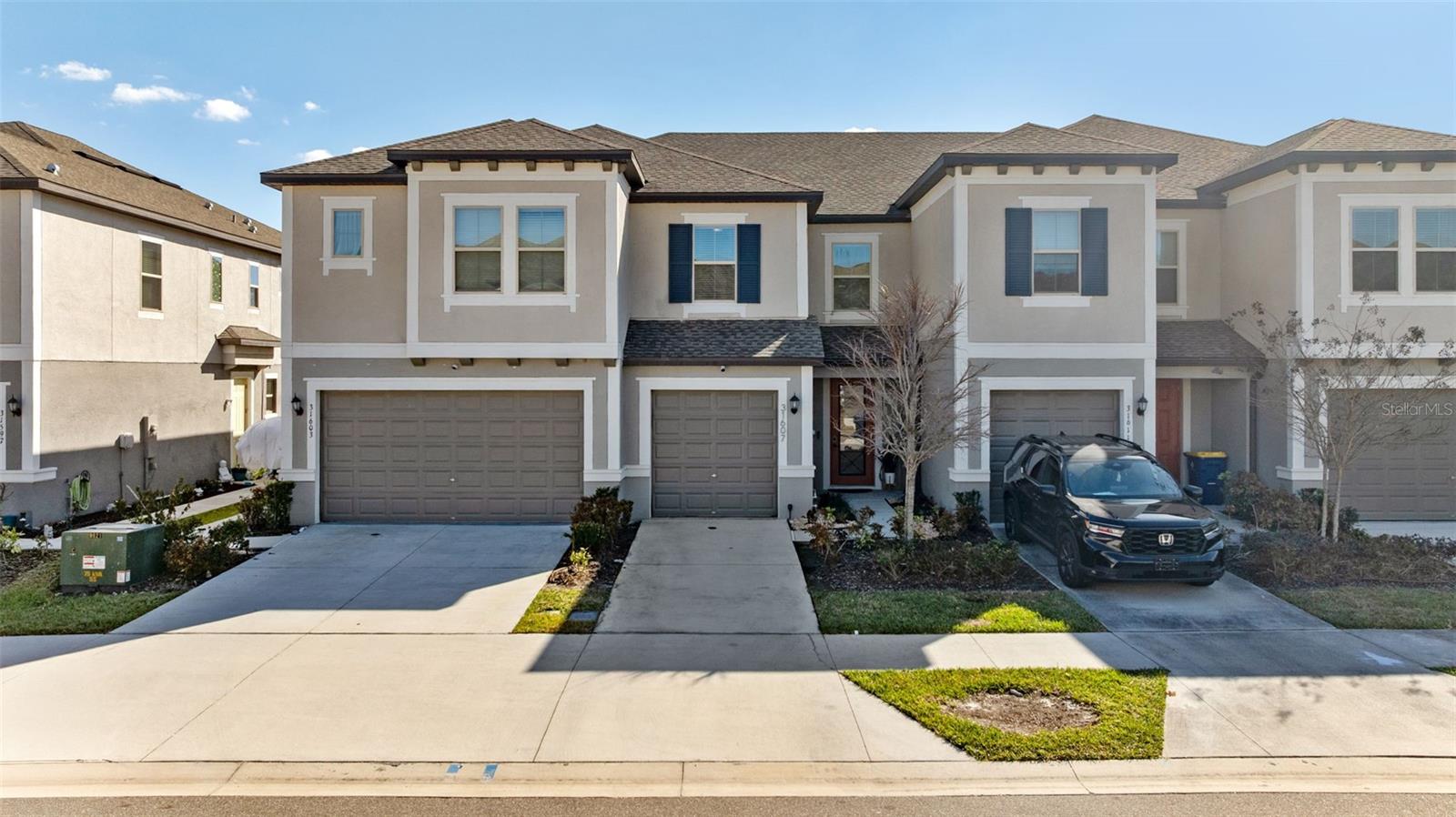 Middle Unit With 1 Car Garage & Driveway