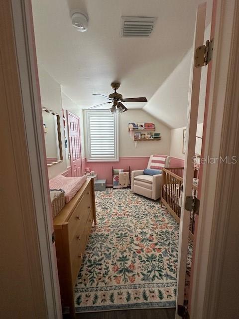 Second bedroom upstairs with plantation shutters.