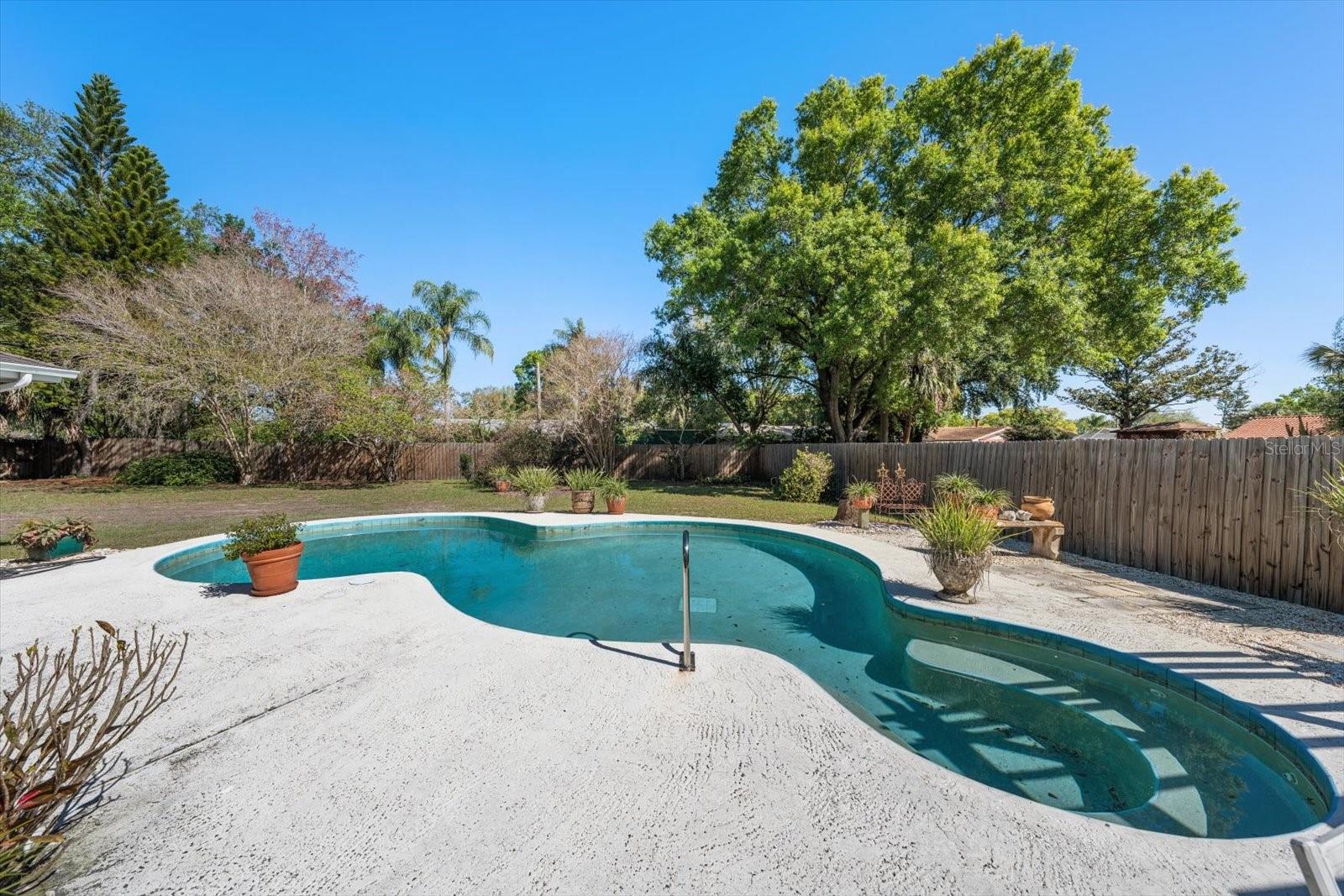 Pool in newly fenced huge backyard.