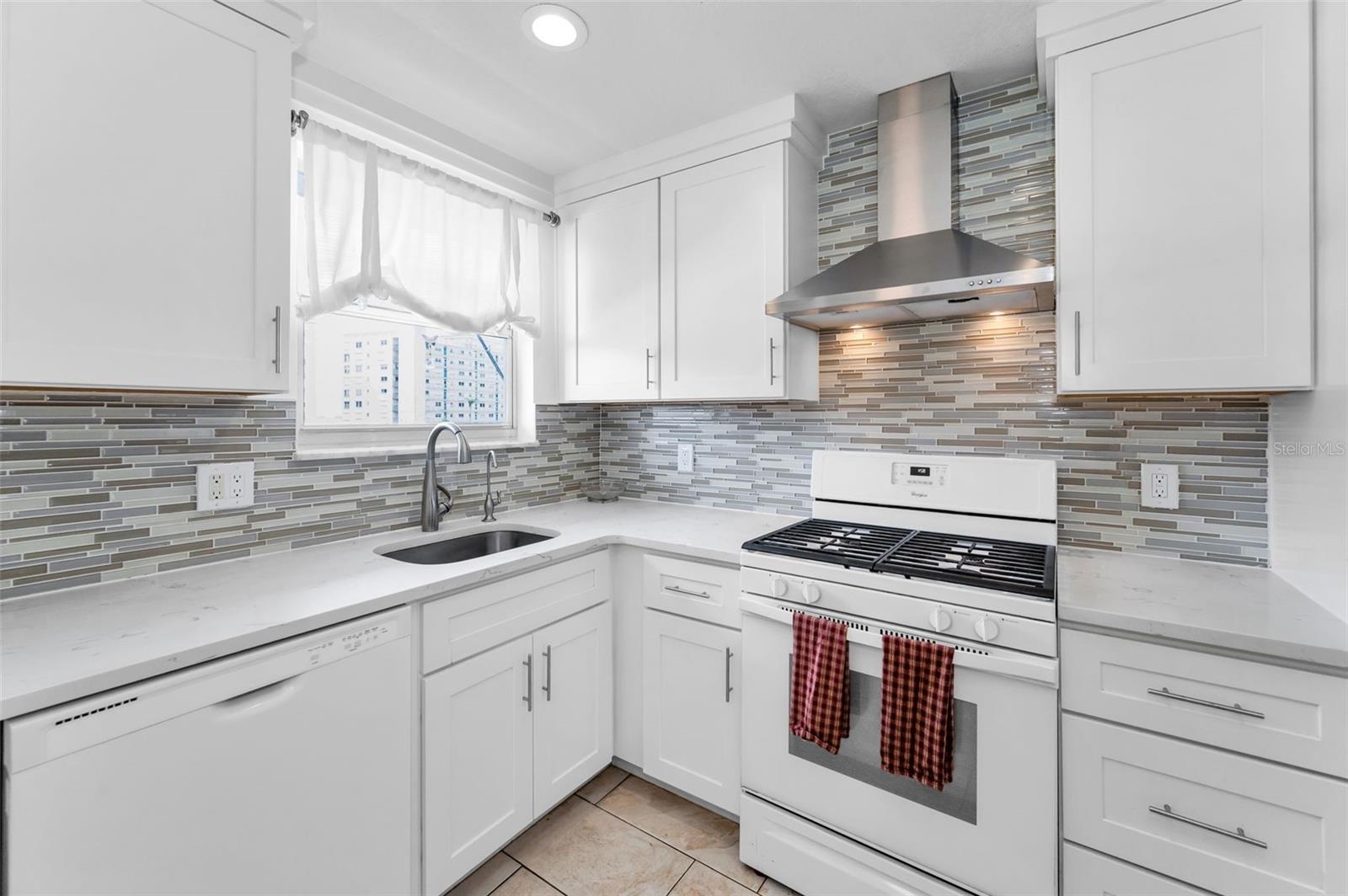 Beautiful backsplash and love the window over the sink!