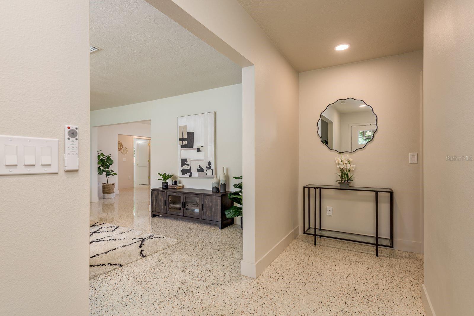 Foyer entrance opens into living room