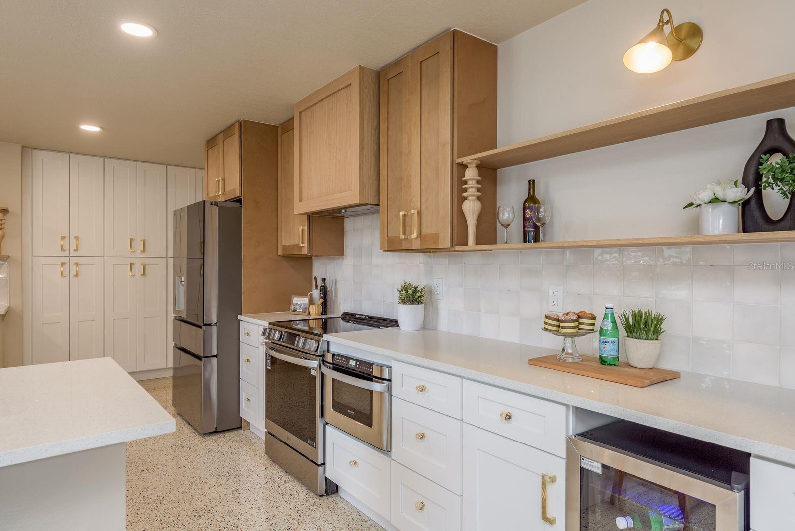 Chef's kitchen, ample counter space, wine cooler, modern quartz counters
