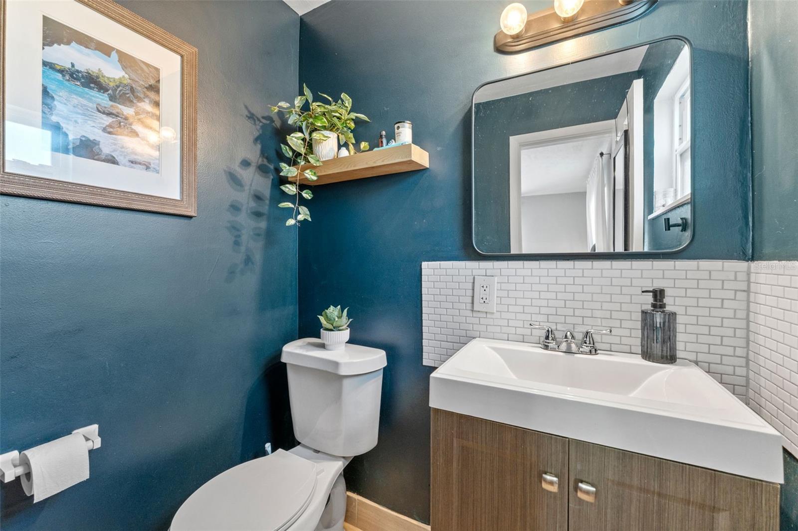 Private primary bathroom featuring a dedicated toilet and sink for added convenience and privacy.