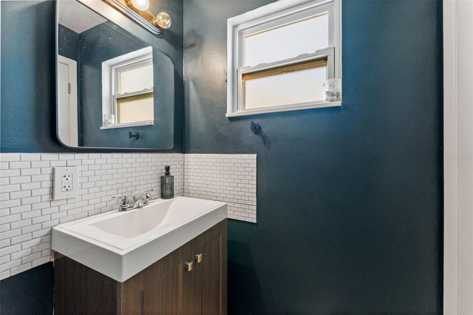 En-suite primary bathroom with private toilet and sink.