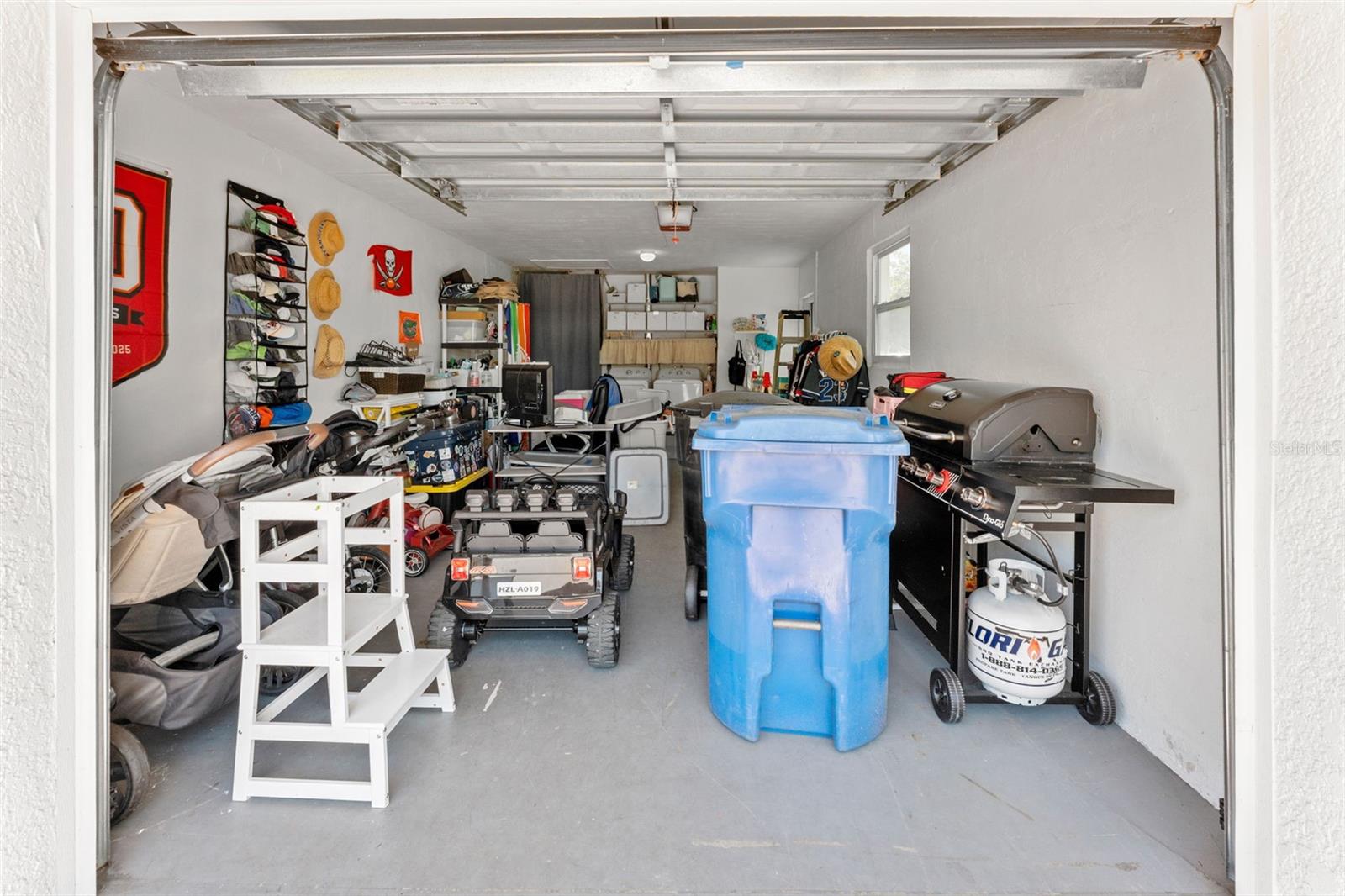 One-car garage providing secure parking and additional storage space.