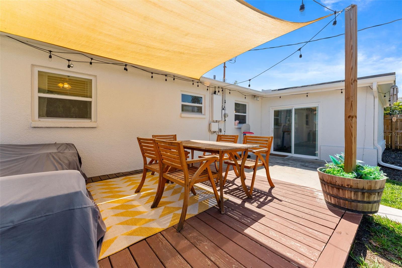 Wood deck with sun shade for all your outdoor furniture