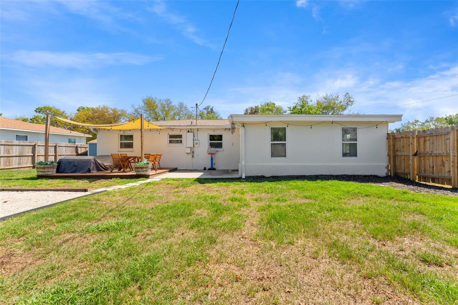 Plenty of private green space in backyard