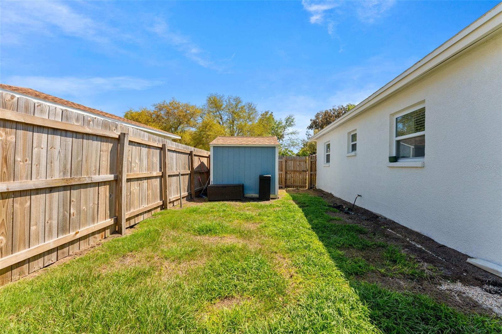 Large side yard for additional green space in backyard