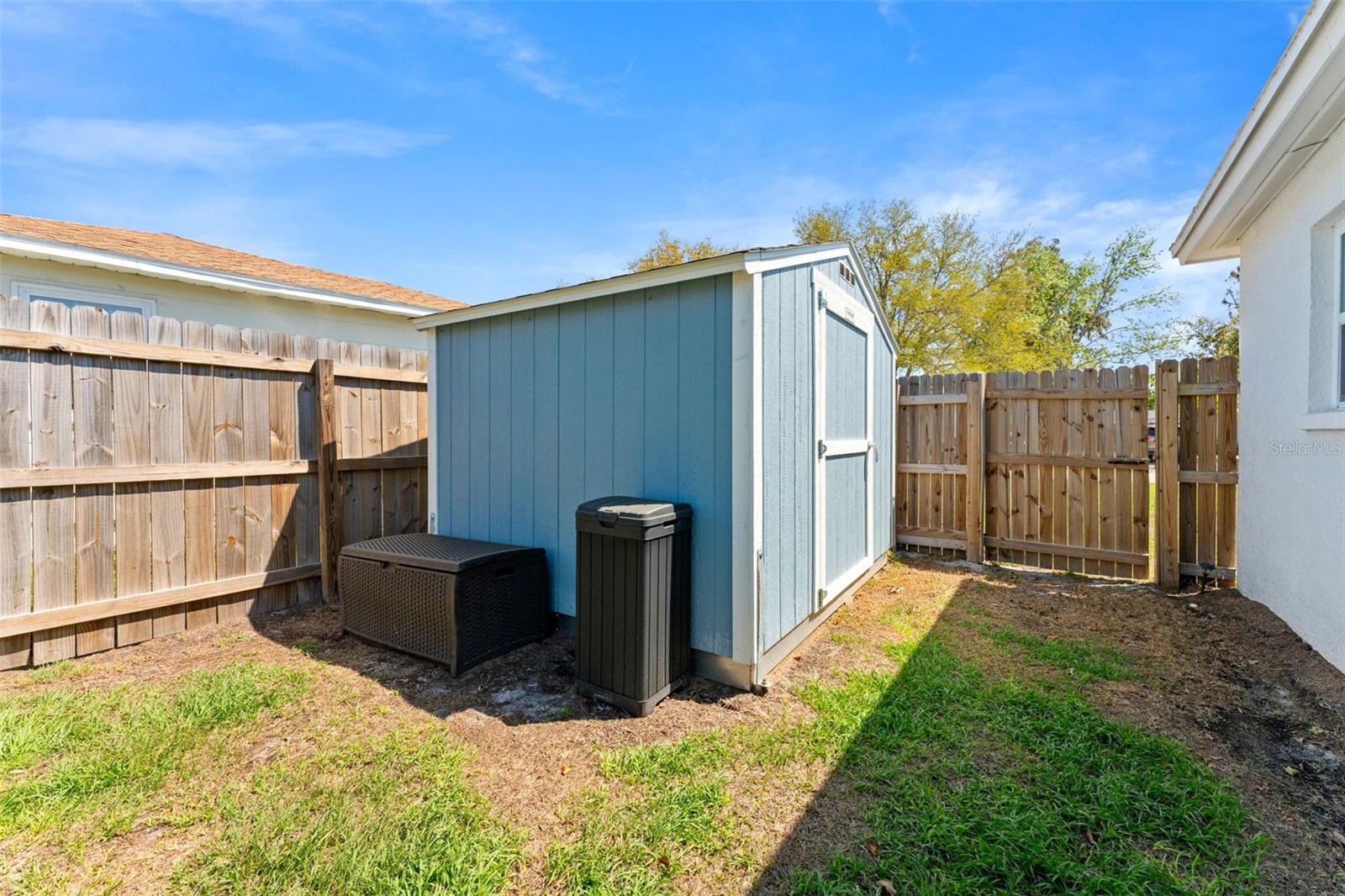 Large shed in backyard for added storage