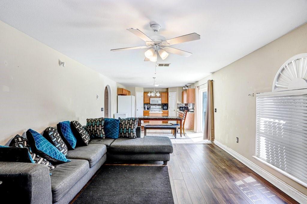 Living Room with new luxury vinyl planks with view into kitchen