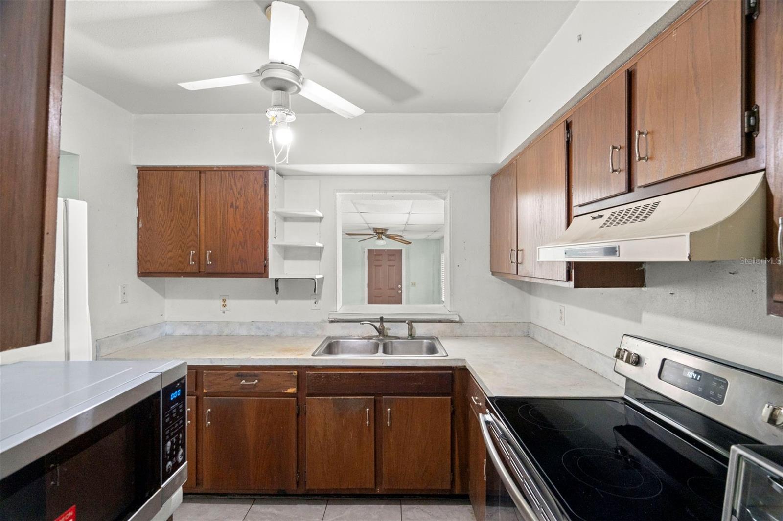 The kitchen sits at the center of the home, opening to a generous bonus room.