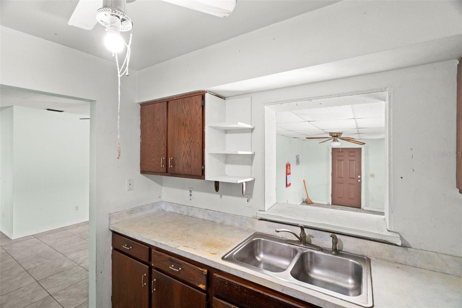 The kitchen sits at the center of the home, opening to a generous bonus room.