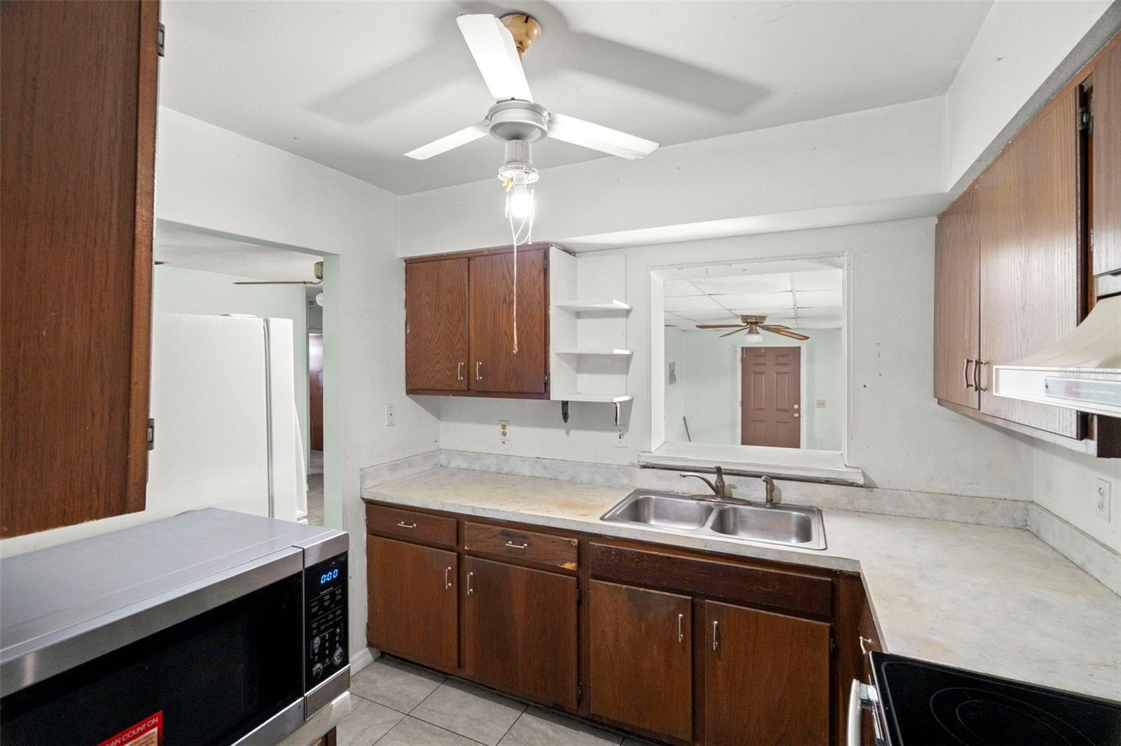 The kitchen sits at the center of the home, opening to a generous bonus room.