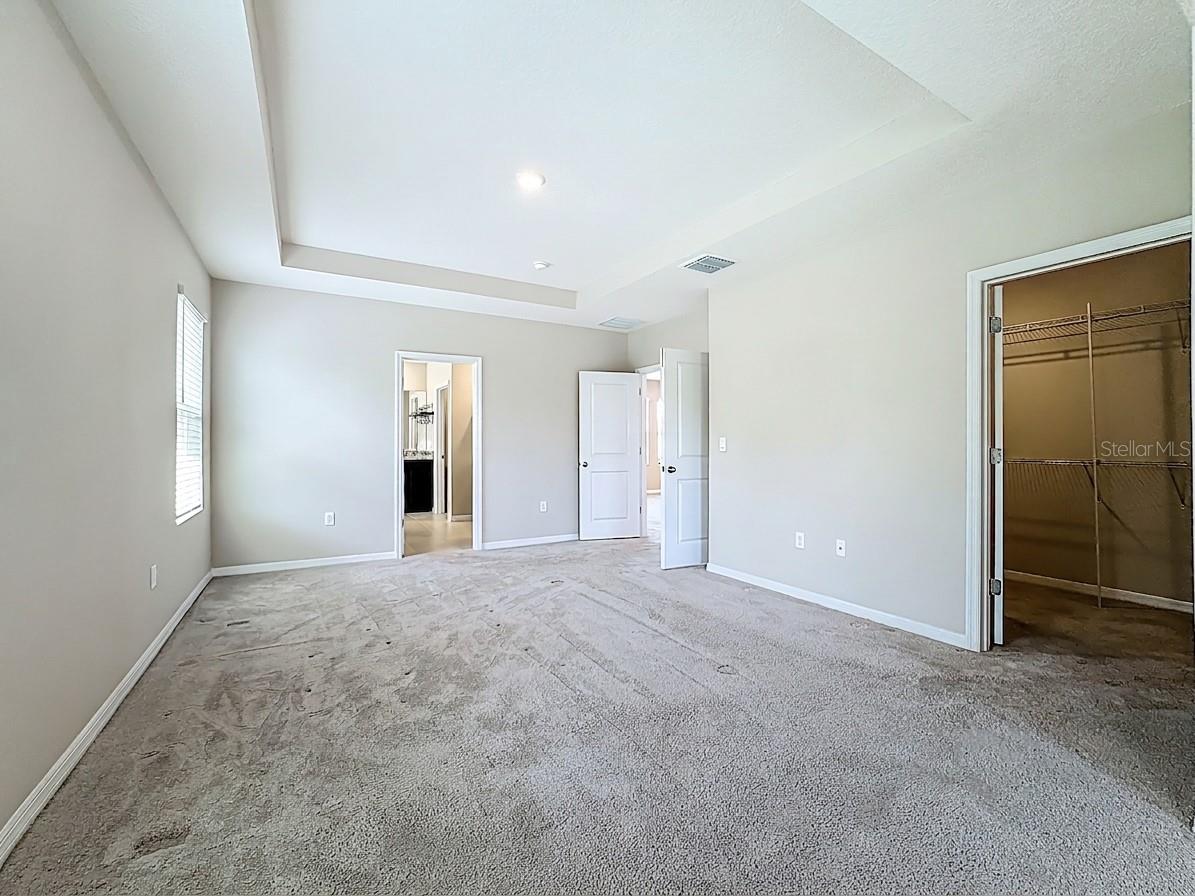 Primary Walk-In-Closet to right