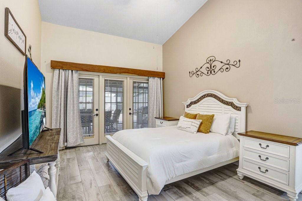 Primary bedroom with vaulted ceilings