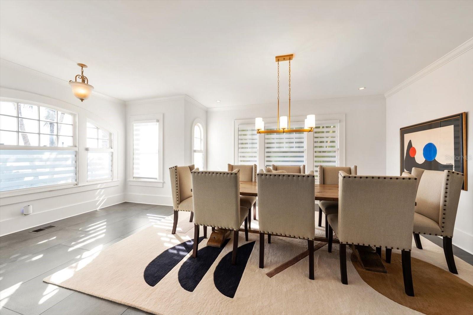 Dining room with rounded windows