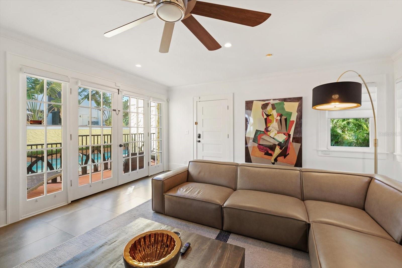 French doors to outdoor patio & pool