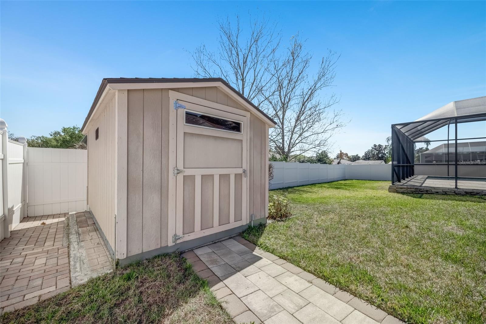 Paved space on the side of Shed