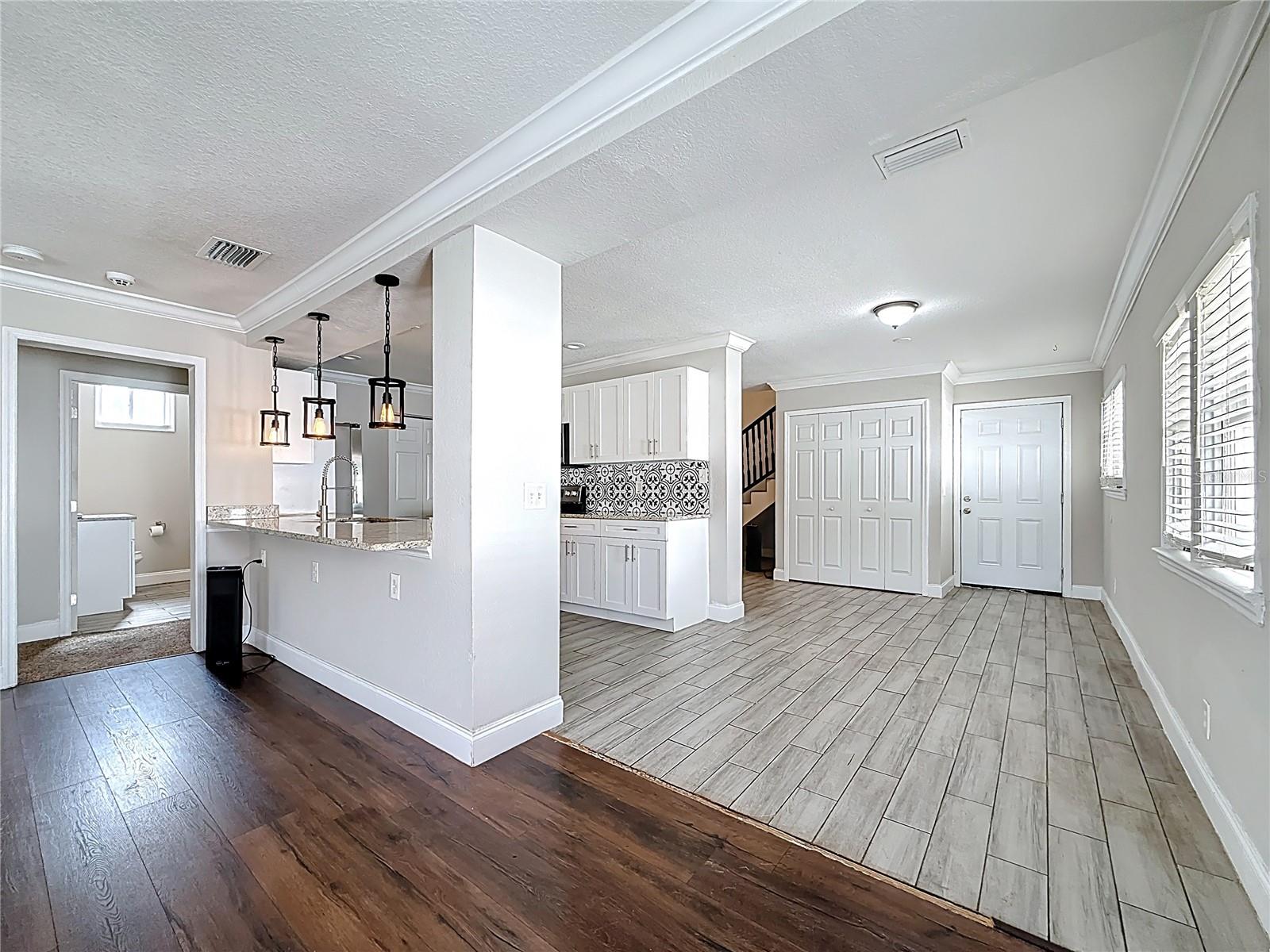View from living room into kitchen and dining room