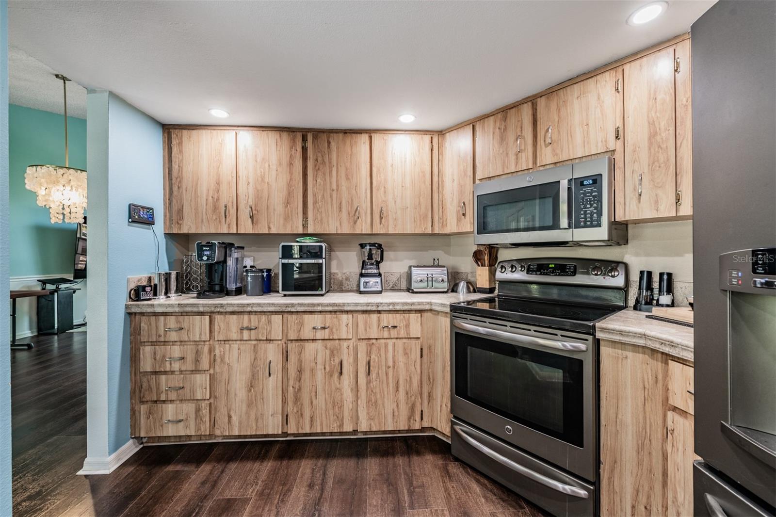 Open Kitchen with a Farmhouse Sink, Stainless Steel Appliances