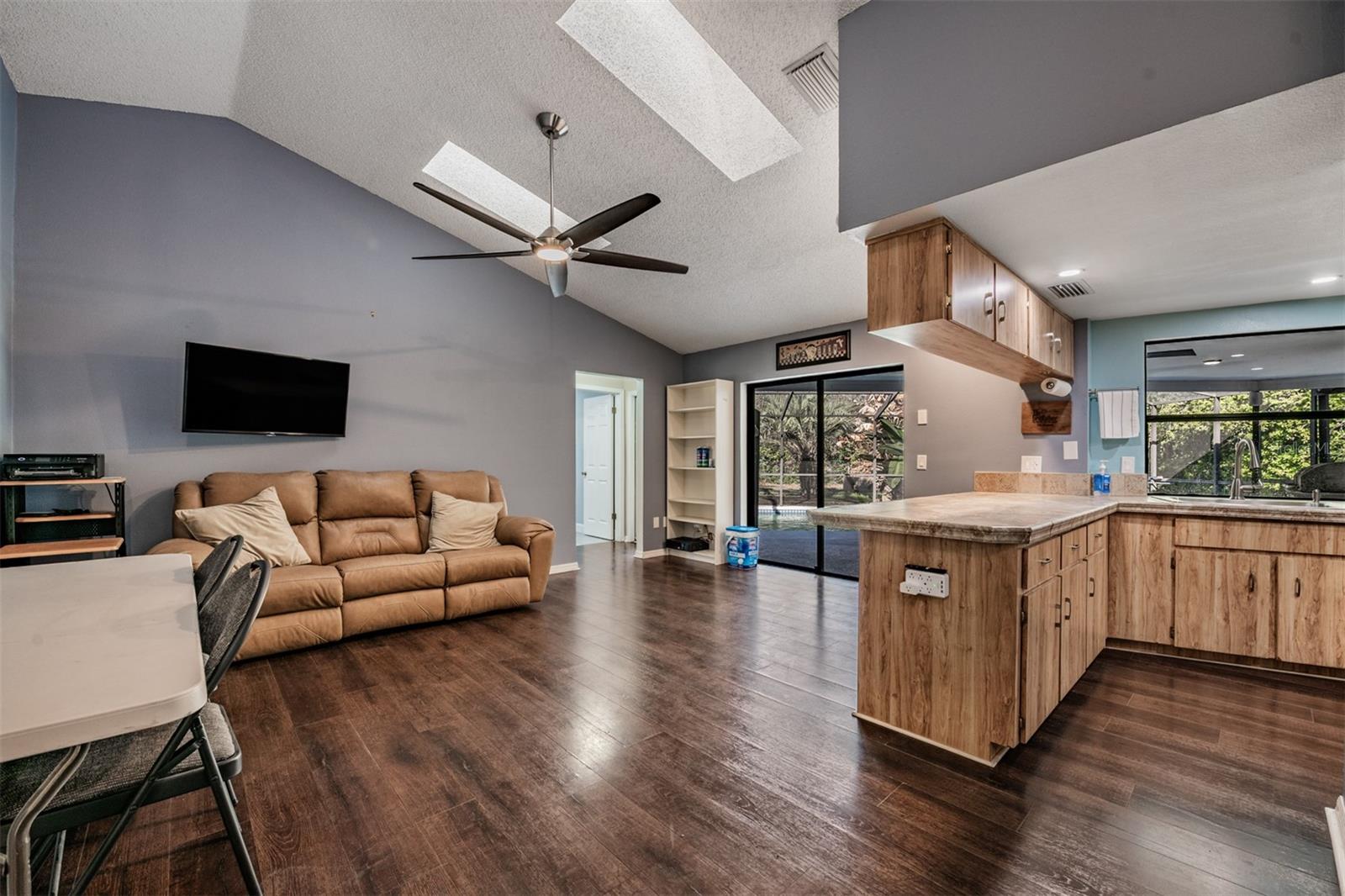 Family room open to the kitchen, Skylights and Vaulted Ceilings.