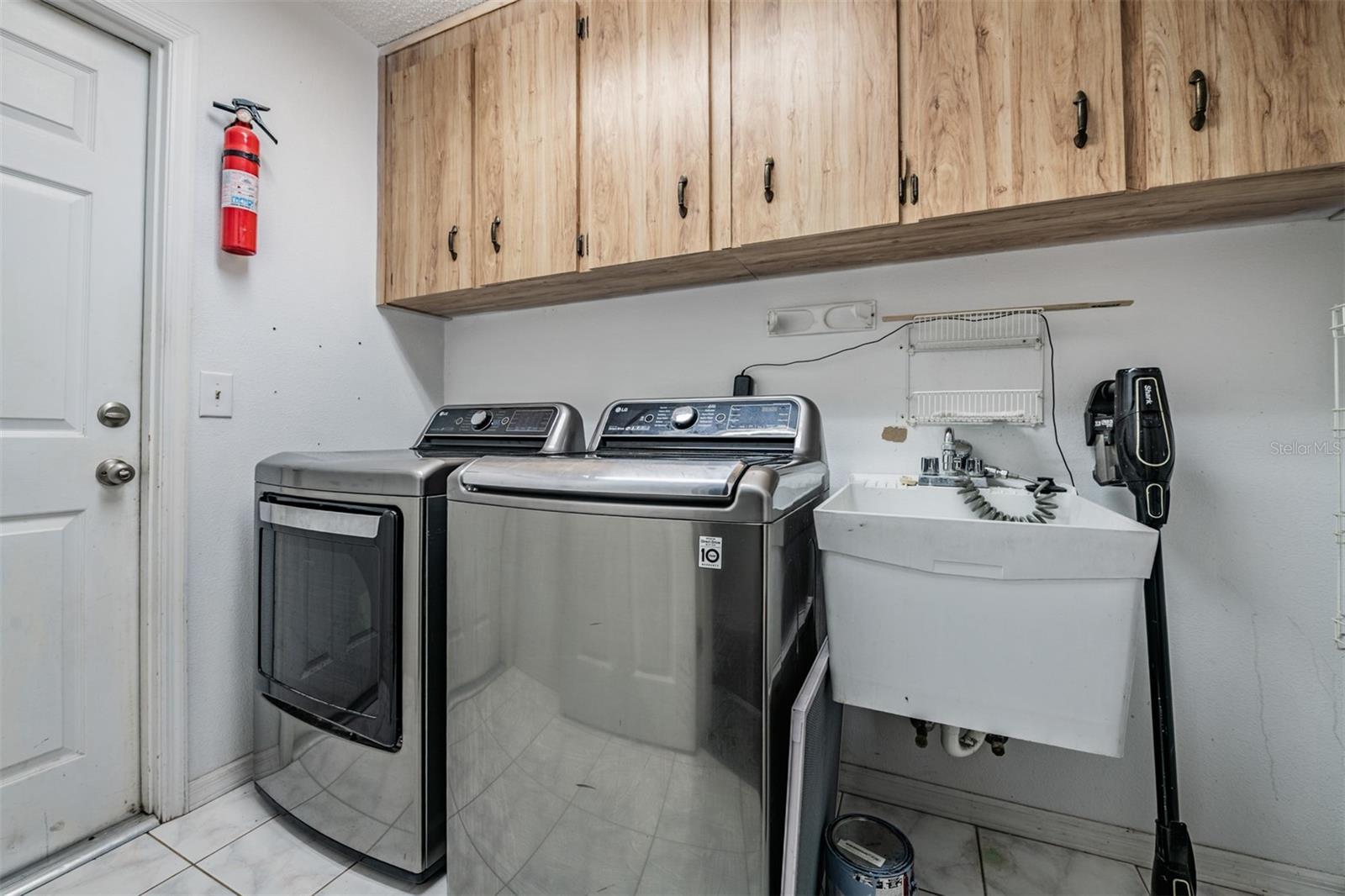 Laundry Room with sink and cabinets.