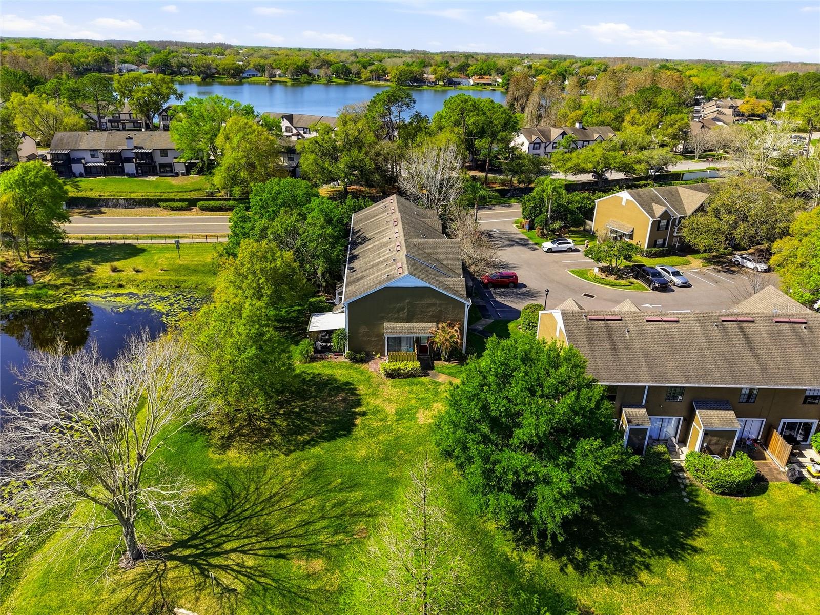 Straight on Aerial View of Unit and Lanai Next To Pond
