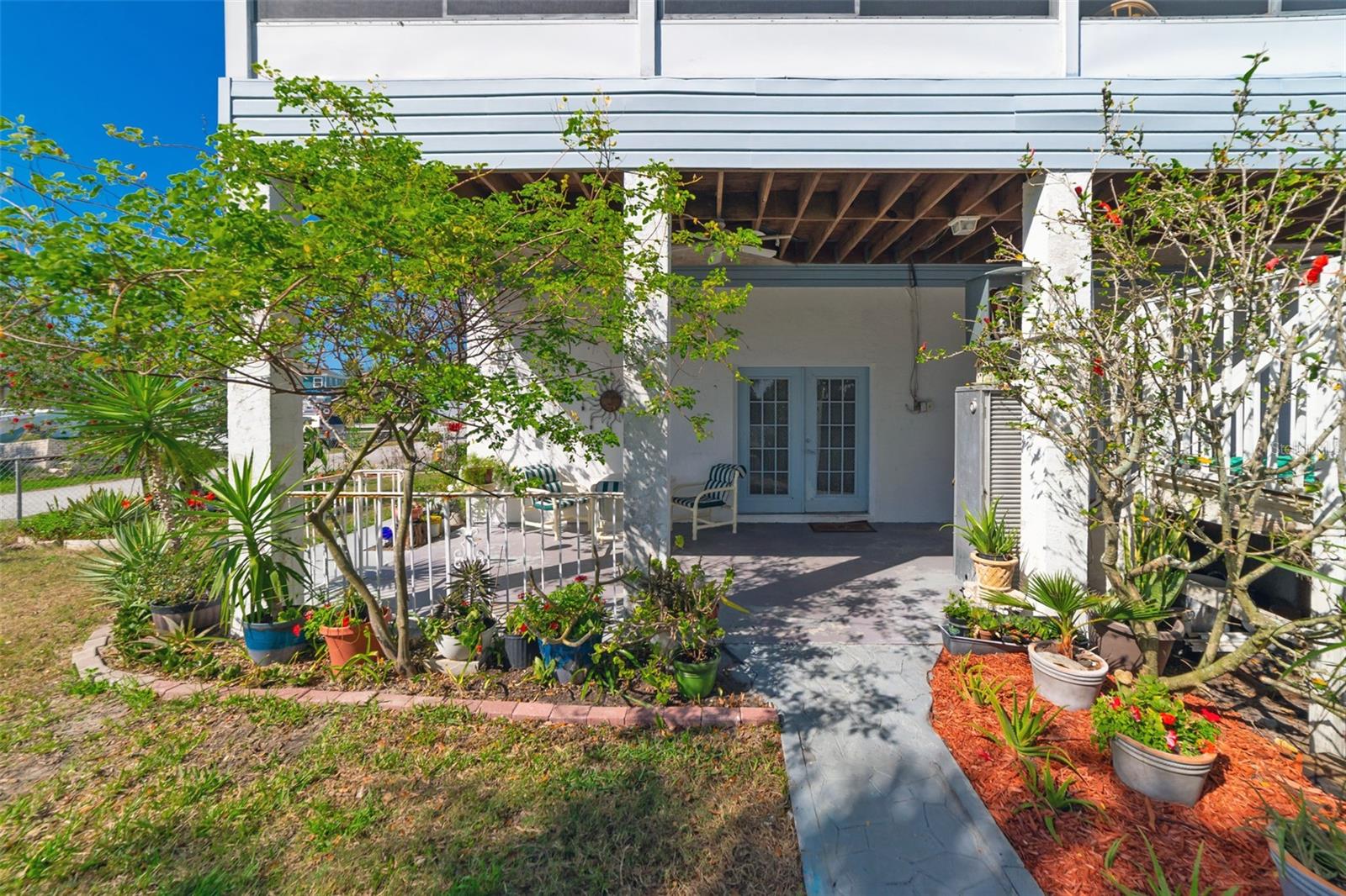 VIEW OF REAR PATIO TO GARAGE