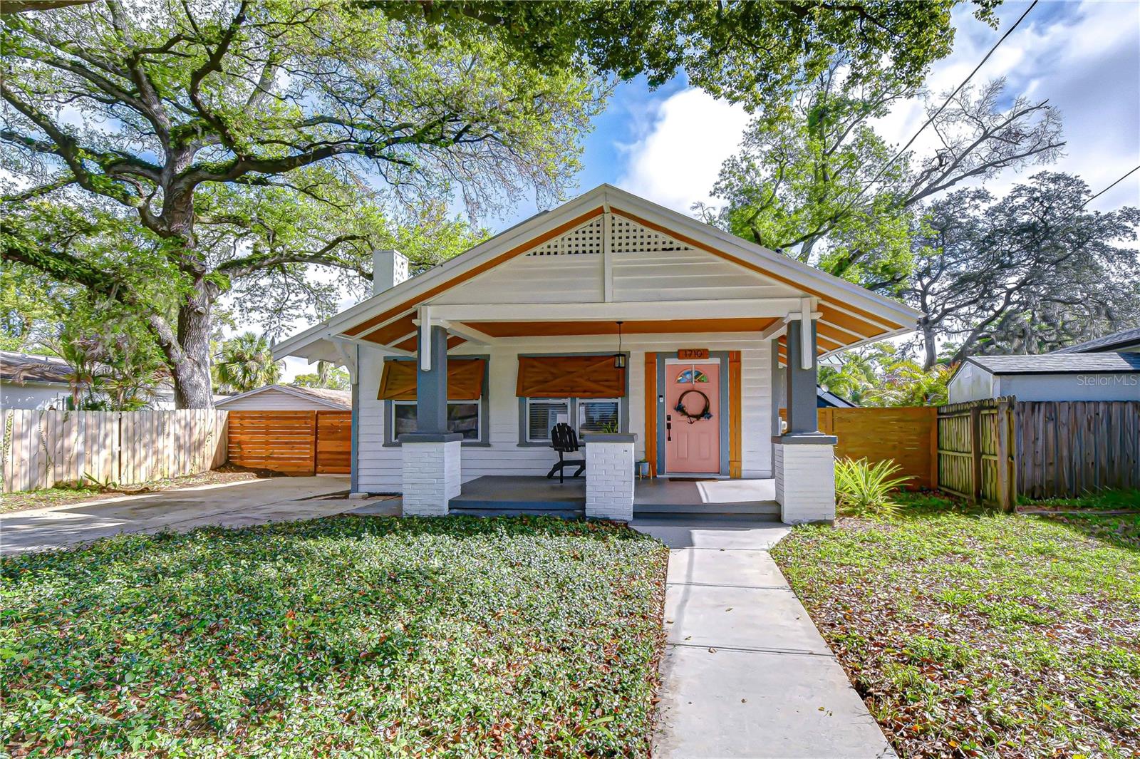Beautifully restored 1928 bungalow nestled beneath the towering oak trees of Riverbend Manor in Seminole Heights.