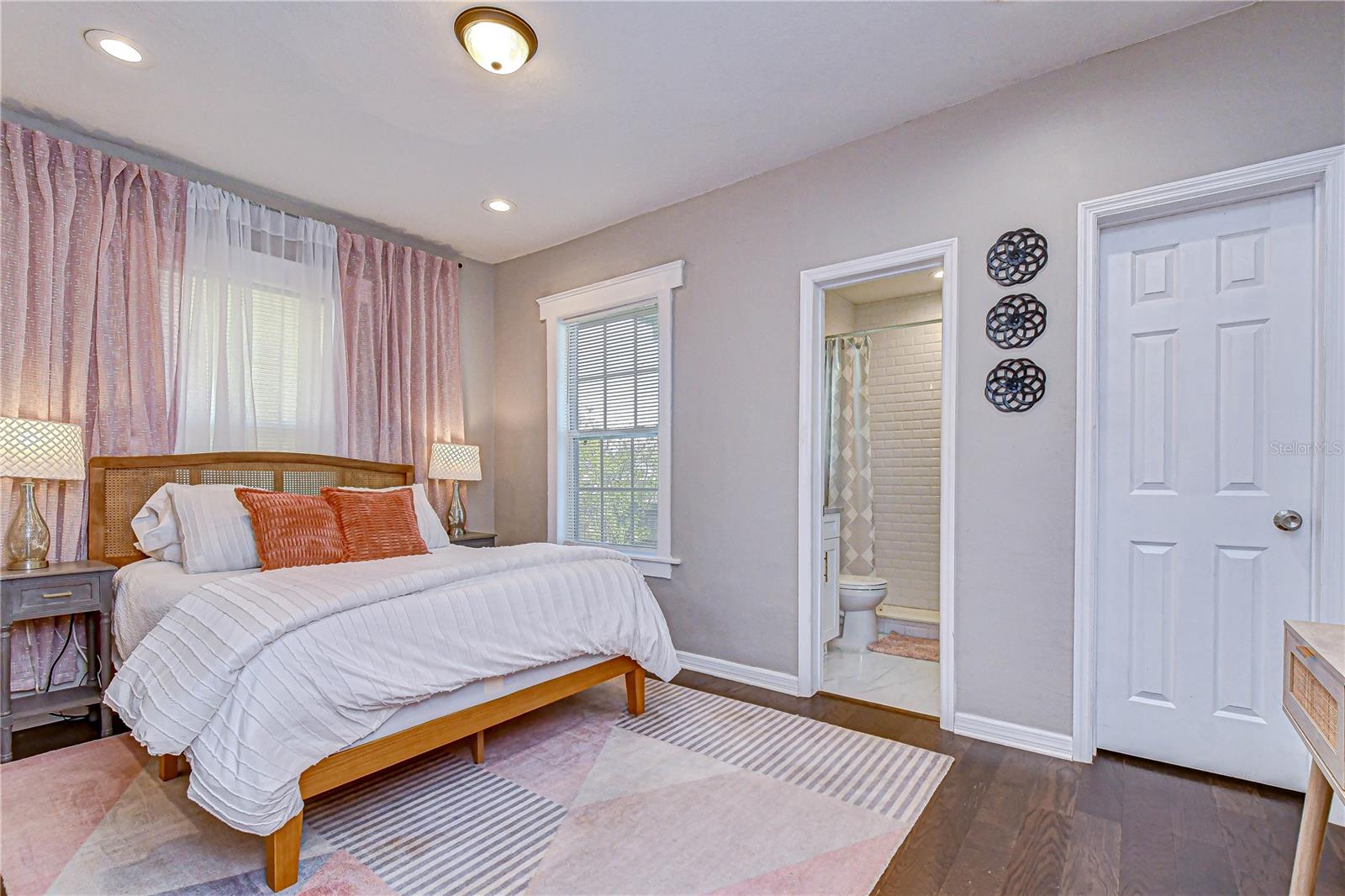 Private primary suite located at the rear of the home for added peace and privacy.