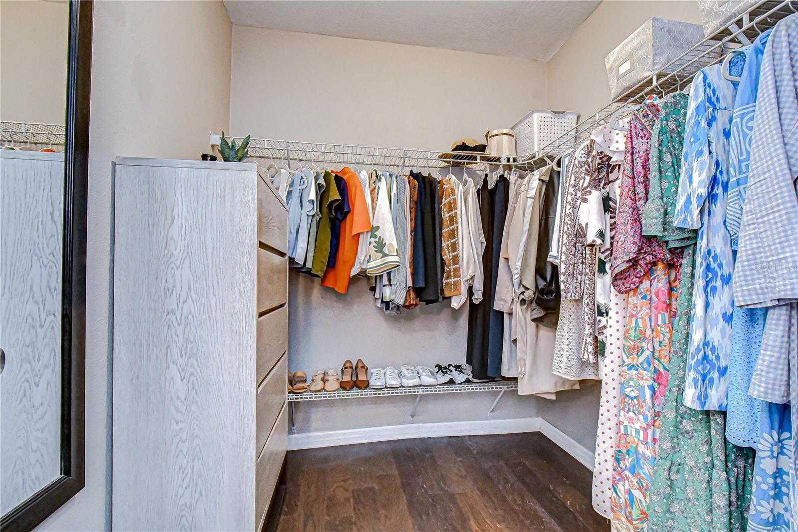 Generous walk-in closet with ample storage.