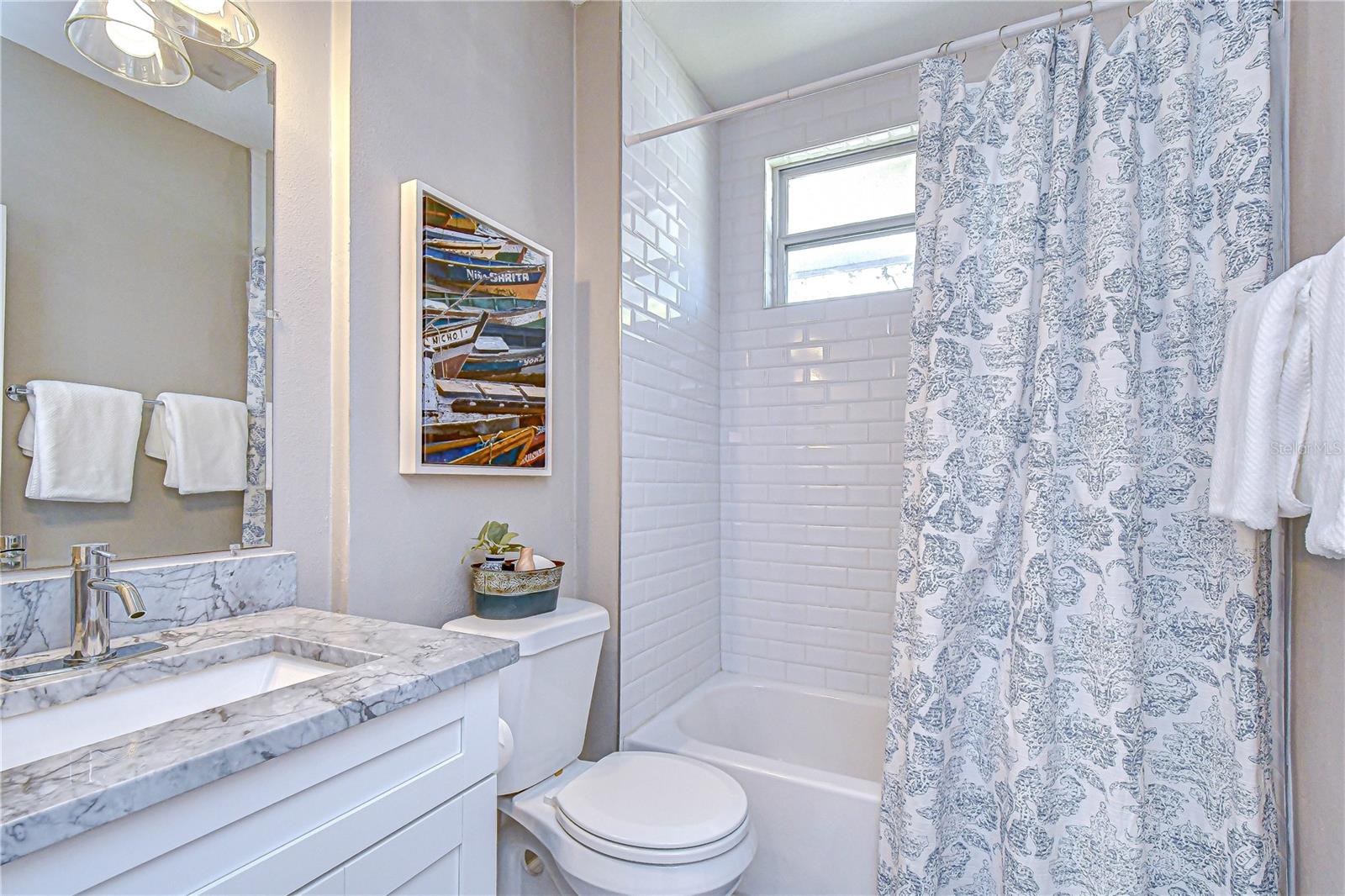 Updated full bathroom serving the additional bedrooms.