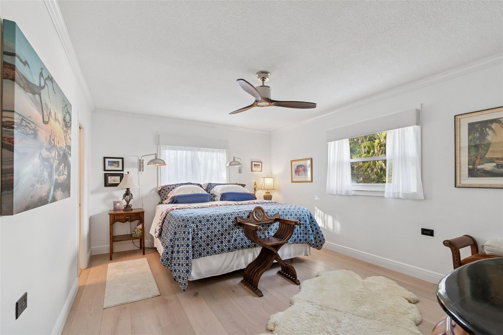 Primary Bedroom with Wood Flooring