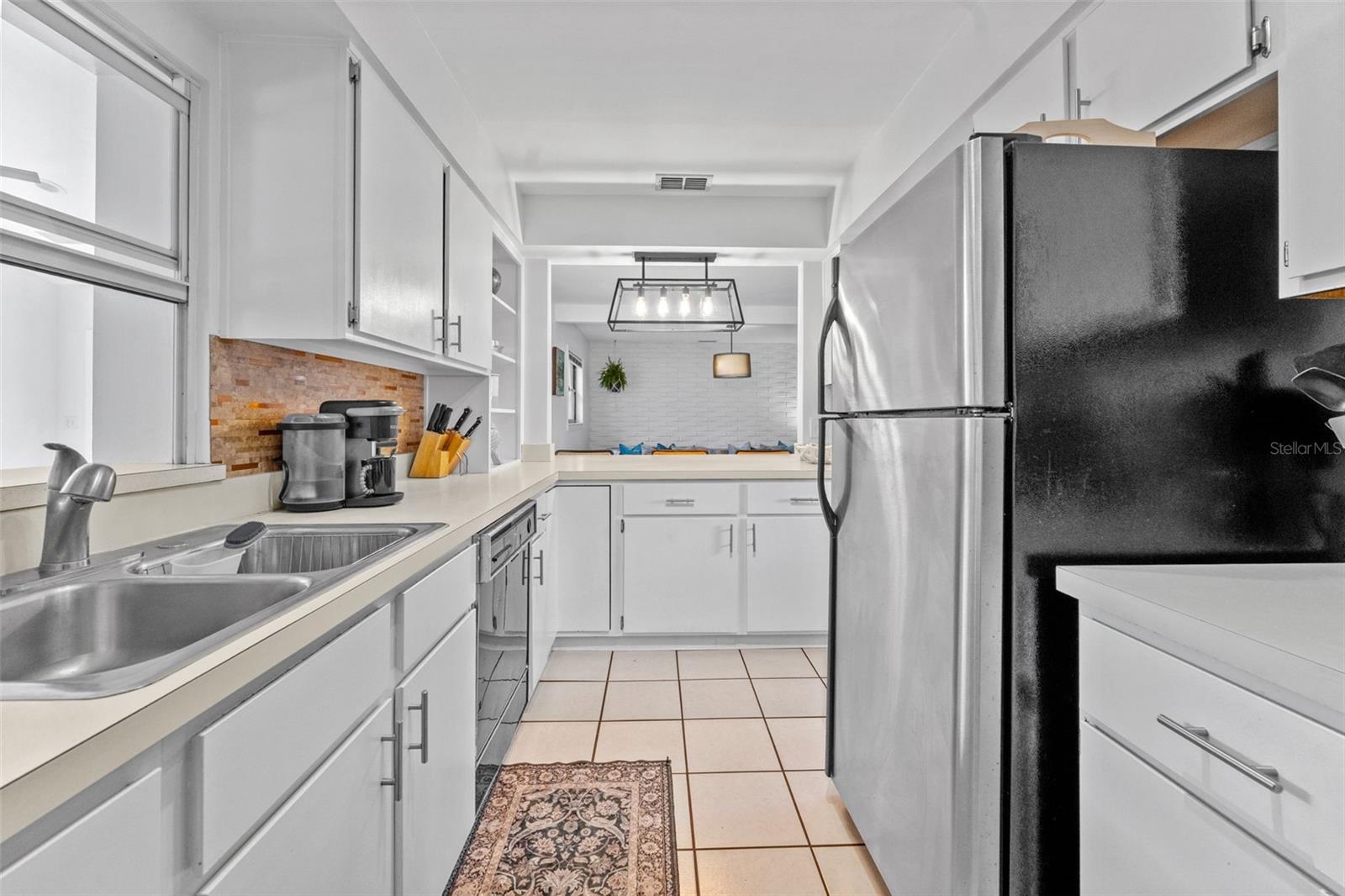 Galley kitchen that opens to the living room and great room