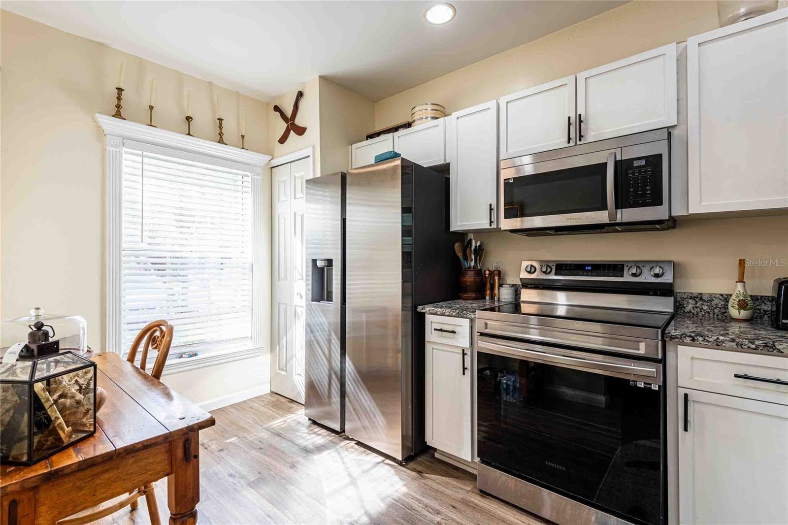 Updated kitchen cabinets and appliances.