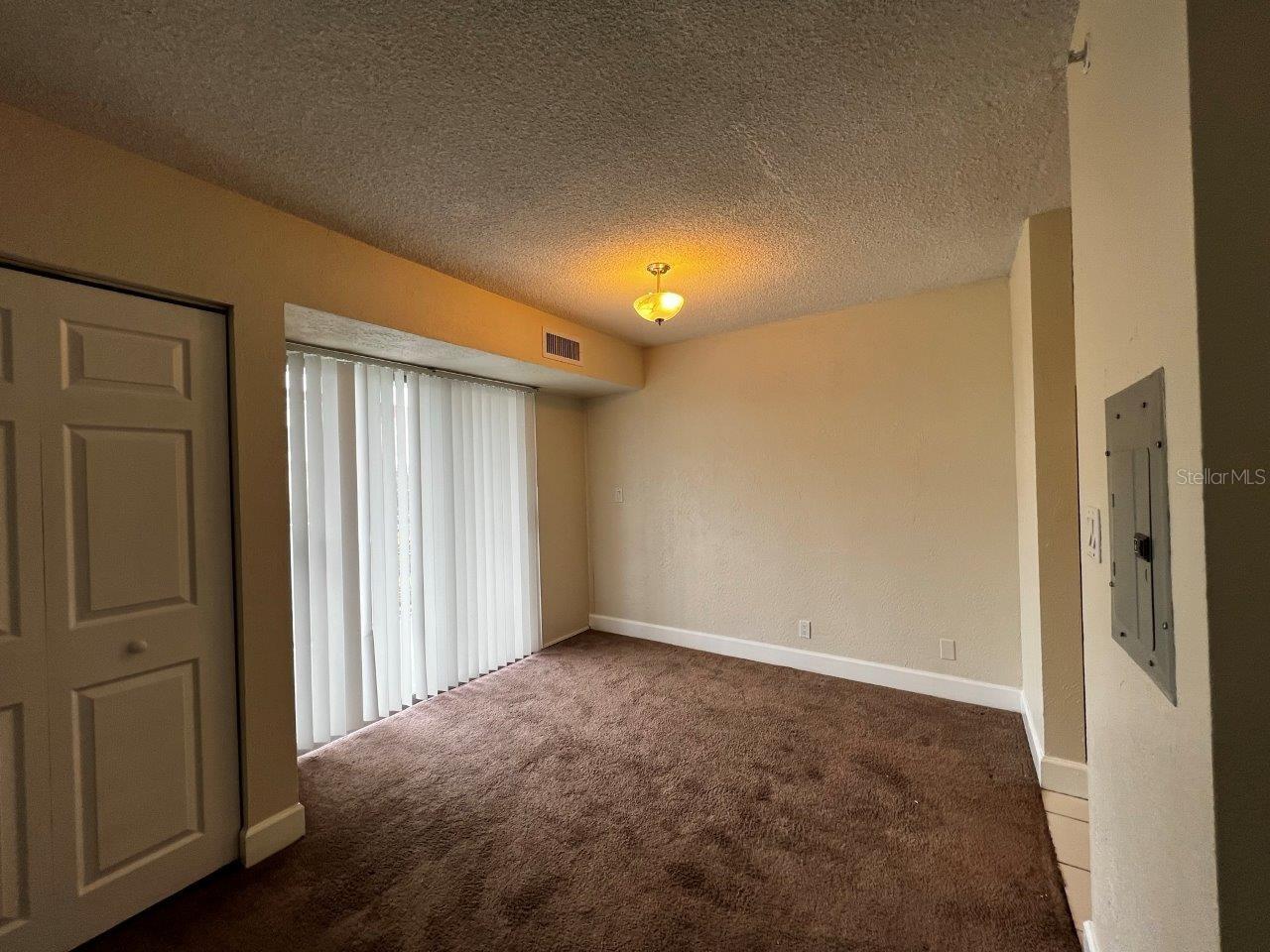 Dining area with sliding doors out to balcony