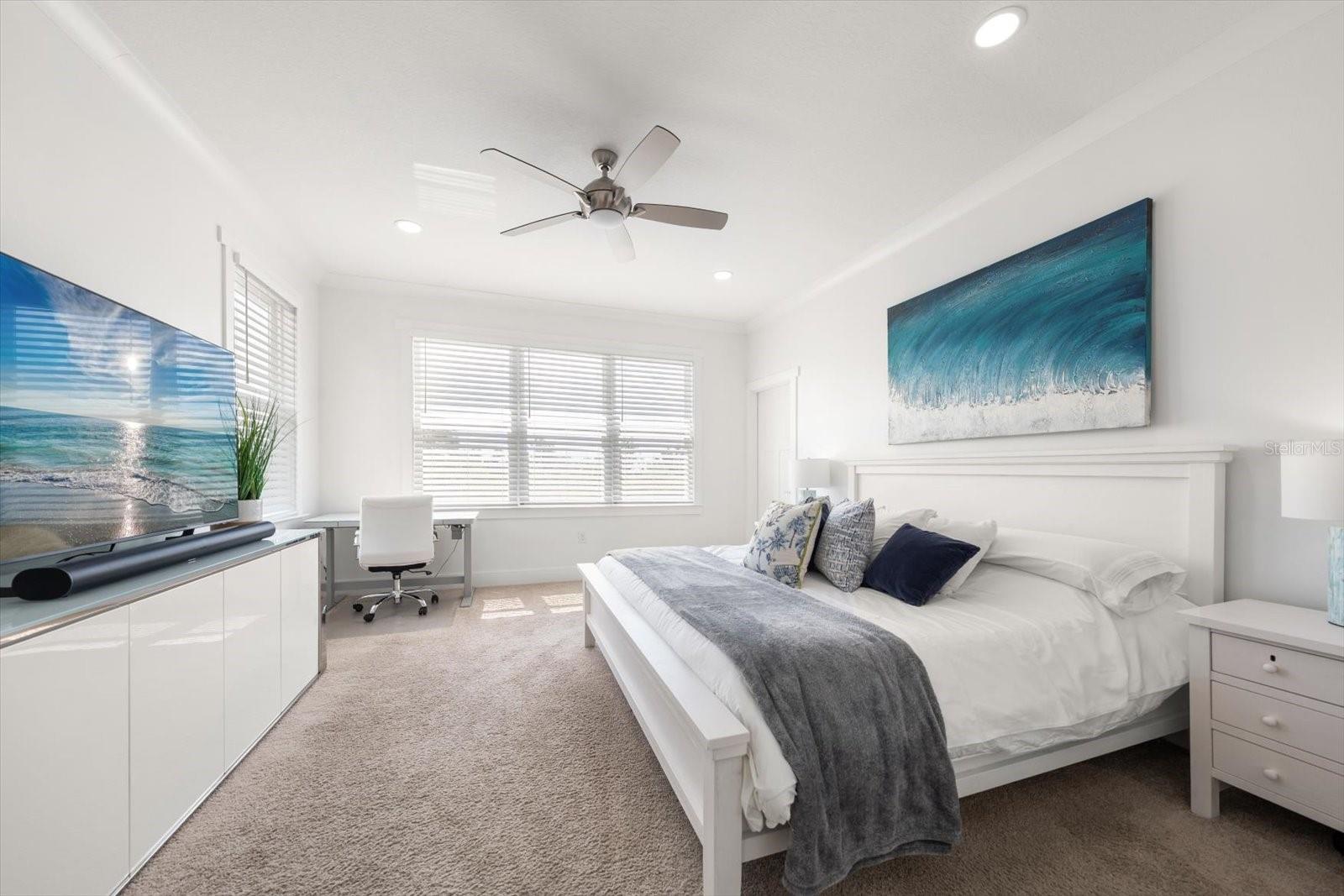 Primary Suite features custom walk-in closet built by California Closets