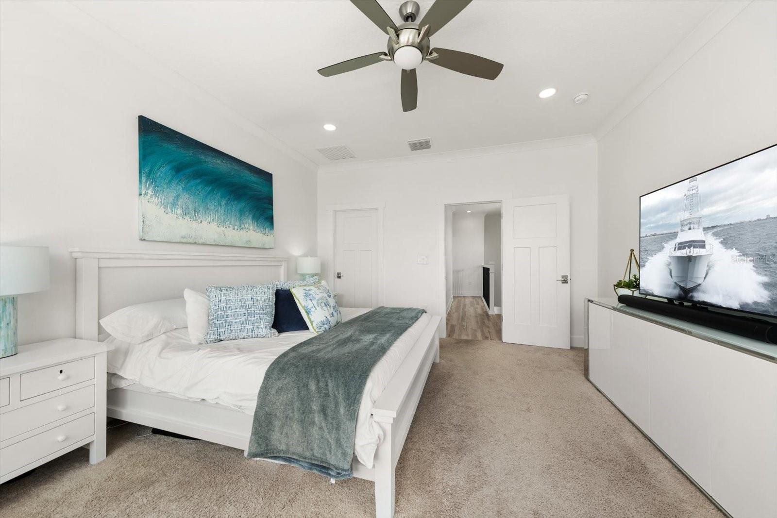 Primary Suite features custom walk-in closet built by California Closets