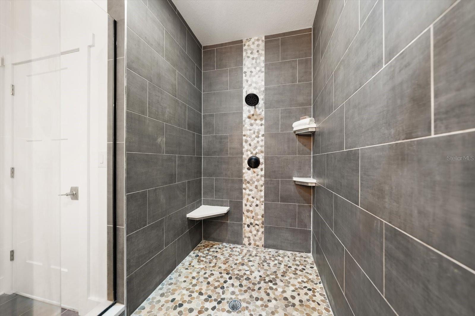 Primary Suite features custom walk-in closet built by California Closets