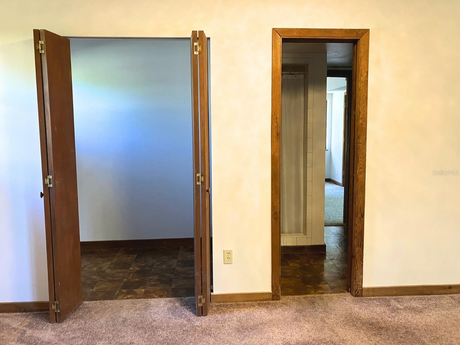 Primary bedroom 2 closets, one walk in & primary bathroom